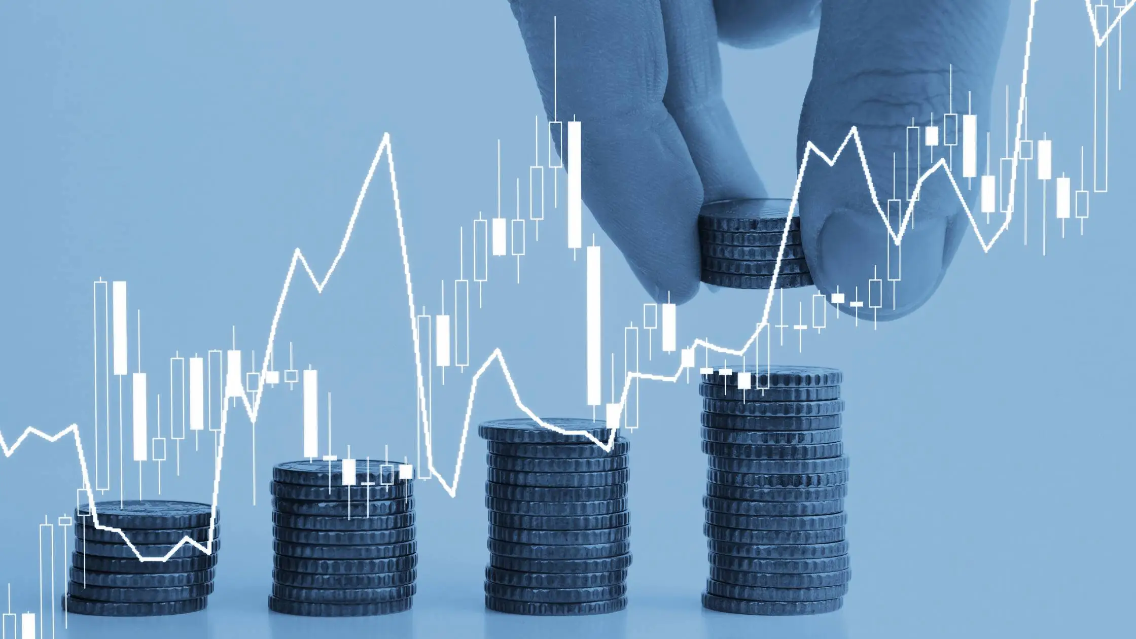  Hands stacking coins to form a rising line graph, symbolizing market value and growth after repiping.